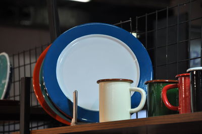 Close-up of blue container on table in building