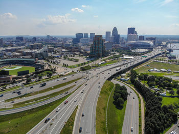 High angle view of street amidst buildings against sky