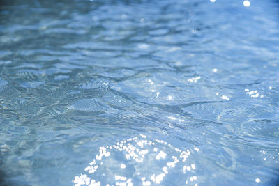 Background image of the sea wave pattern shining in the sun