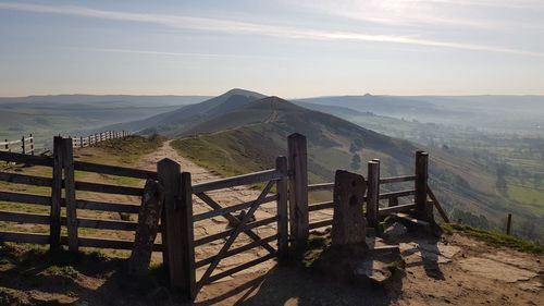 Scenic view of landscape and mountains against sky