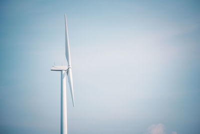 Low angle view of wind turbine against sky