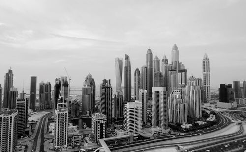 Aerial view of cityscape against sky