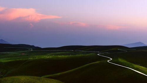 Scenic view of landscape against sky during sunset