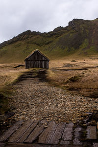 Built structure on mountain against sky