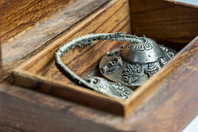 Close-up of cymbals in wooden box