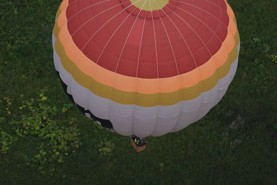 Hot air balloon flying over field