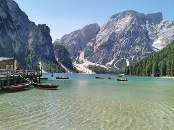 Scenic view of sea and mountains against sky