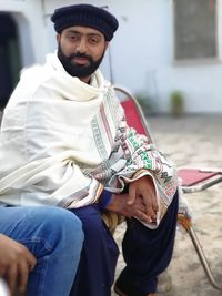 Portrait of man wearing shawl