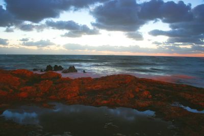 Scenic view of sea against sky at sunset