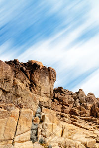 Rock formation on rocks against sky