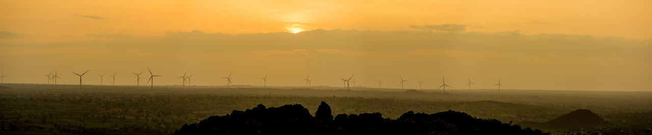 Scenic view of landscape against sky during sunset