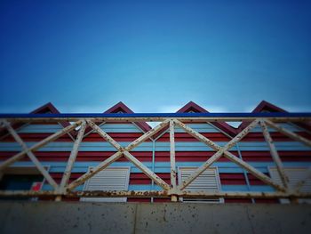 Low angle view of staircase against clear blue sky