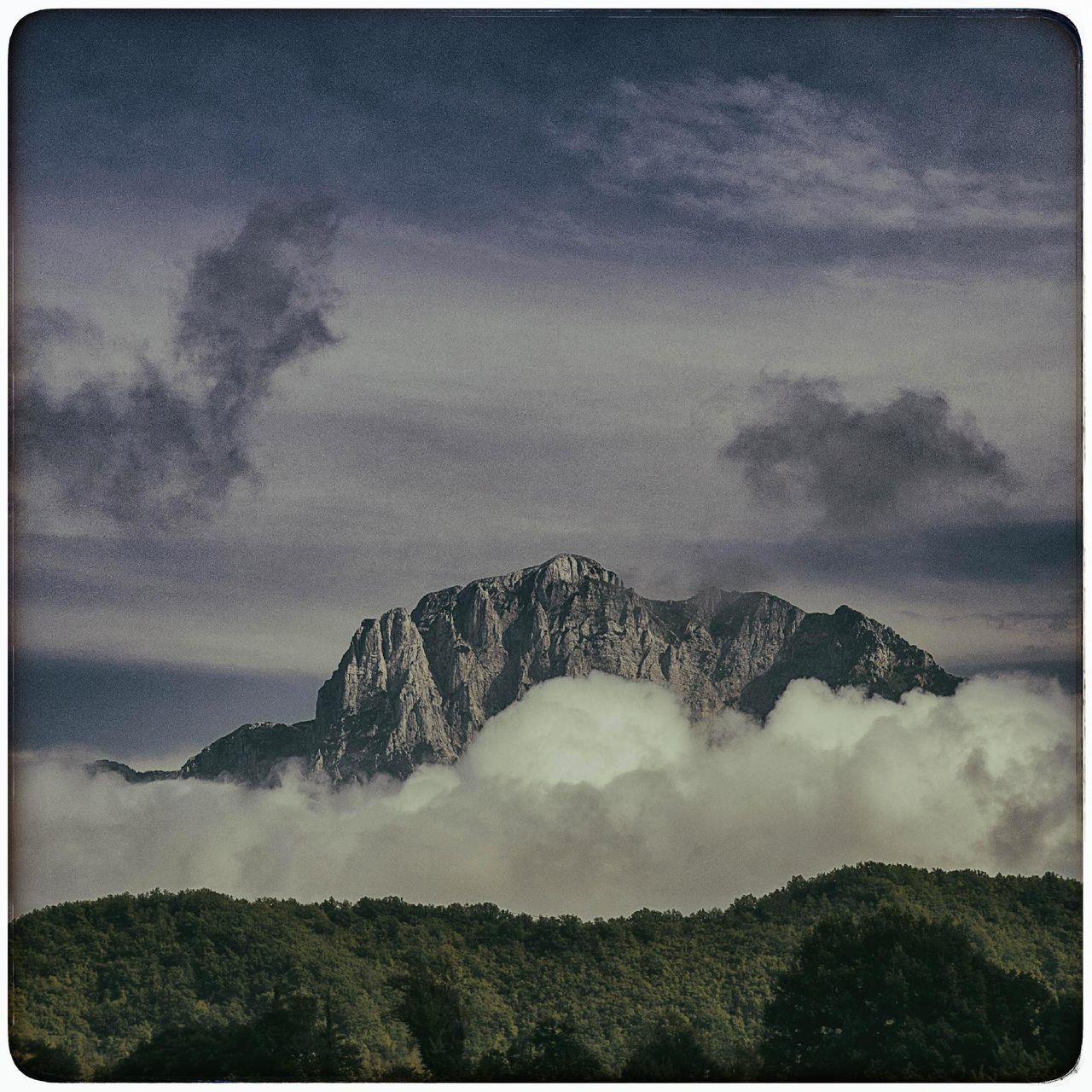 SCENIC VIEW OF CLOUDS OVER MOUNTAIN