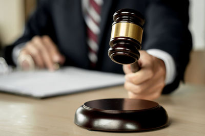 Close-up of hands working on table