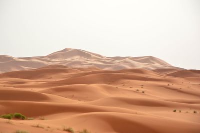 Scenic view of desert against clear sky