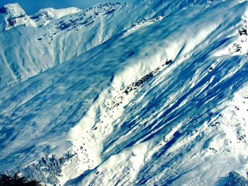 Scenic view of snow covered mountains