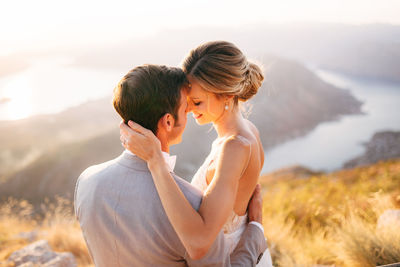 Young couple standing on mountain