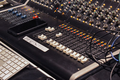 High angle view of audio mixing console in recording studio