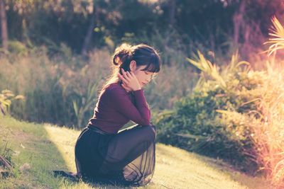 Woman sitting outdoors