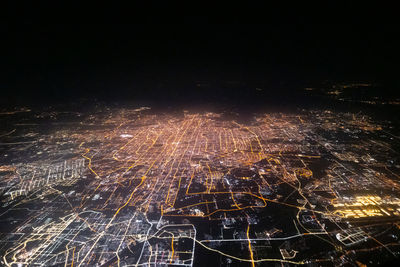 High angle view of illuminated cityscape at night