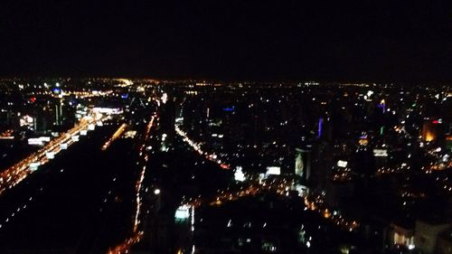 High angle view of illuminated city at night