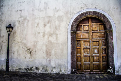 Closed wooden door on old building