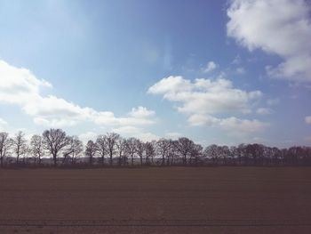 Scenic view of landscape against cloudy sky