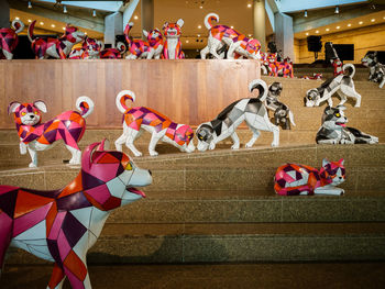 Multi colored sculpture in front of toys