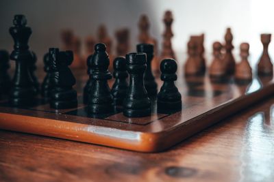 Close-up of chess pieces on table