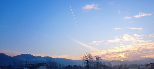 Scenic view of vapor trails in sky