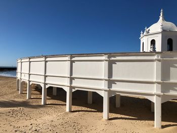 View of beach against clear sky