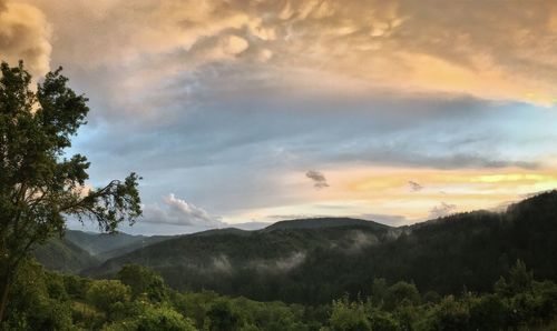 Scenic view of mountains against sky during sunset