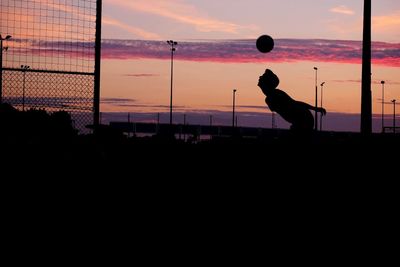 Silhouette of woman at sunset