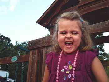 Portrait of girl against sky