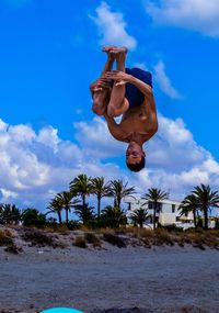 Low angle view of old building against blue sky
