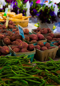 Close-up of trays of vegetables for sale at market stall