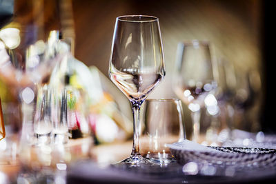 Luxury table settings for fine dining with and glassware, pouring wine to glass. 