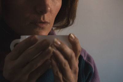 Close-up of woman drinking coffee