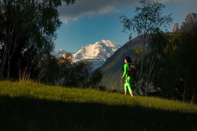 Man standing on field against sky