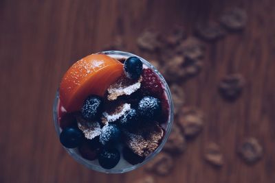 Directly above shot of fruits in glass on table