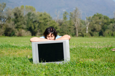 Woman on field against sky