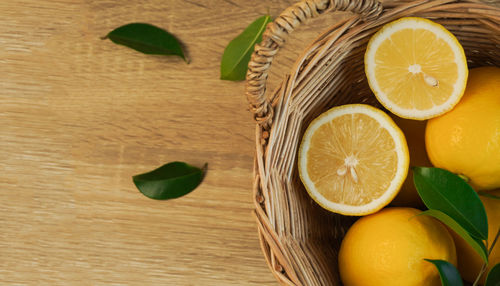 Directly above shot of fruits and leaves on table
