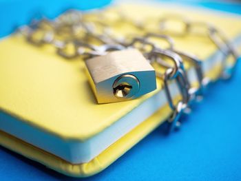 Close-up of padlock on table