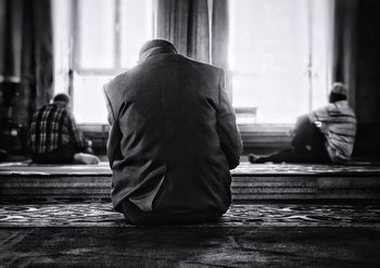 Men sitting in mosque