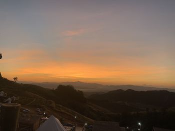 Scenic view of mountains against sky during sunset