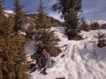 Full length of person on snow covered landscape