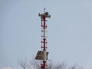 Low angle view of communications tower against clear sky