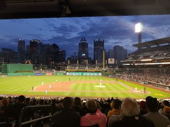 Panoramic view of crowd in city against sky