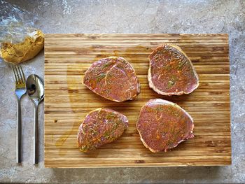 High angle view of bread on cutting board