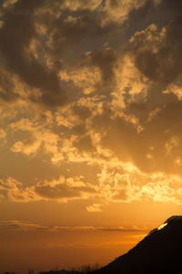 Scenic view of dramatic sky during sunset